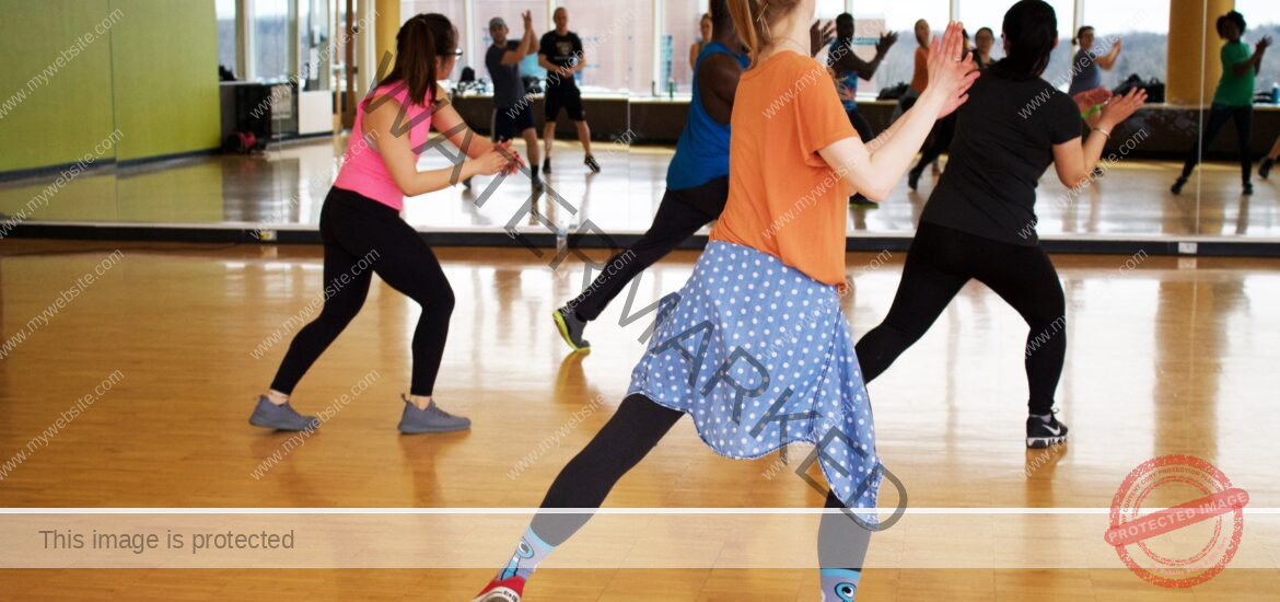 women dancing near mirror